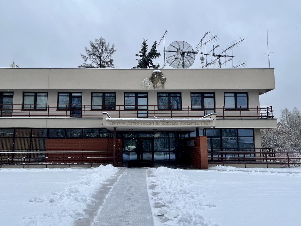 image of the exterior of CAMK institute, with snow on the ground and a path carved out of the snow